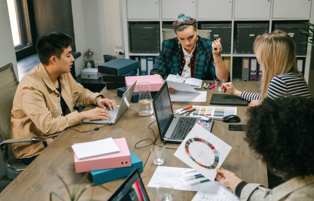 Startup founders working on financial reports and documents showing Accounting Compliance for Startups in India.