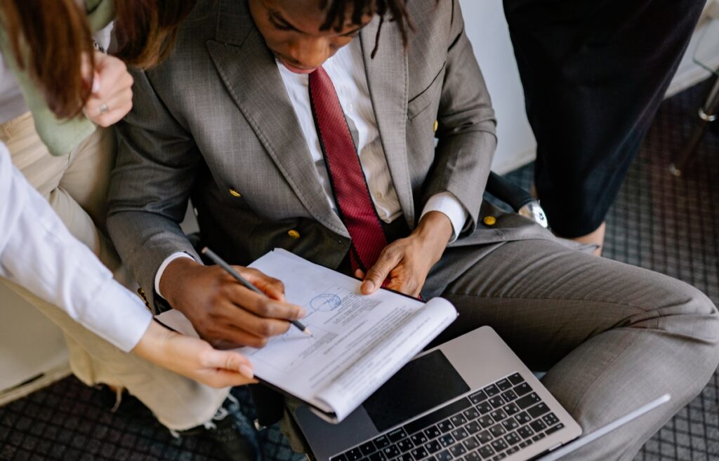 Legal & Tax Mistakes Startups concept with entrepreneur and documents