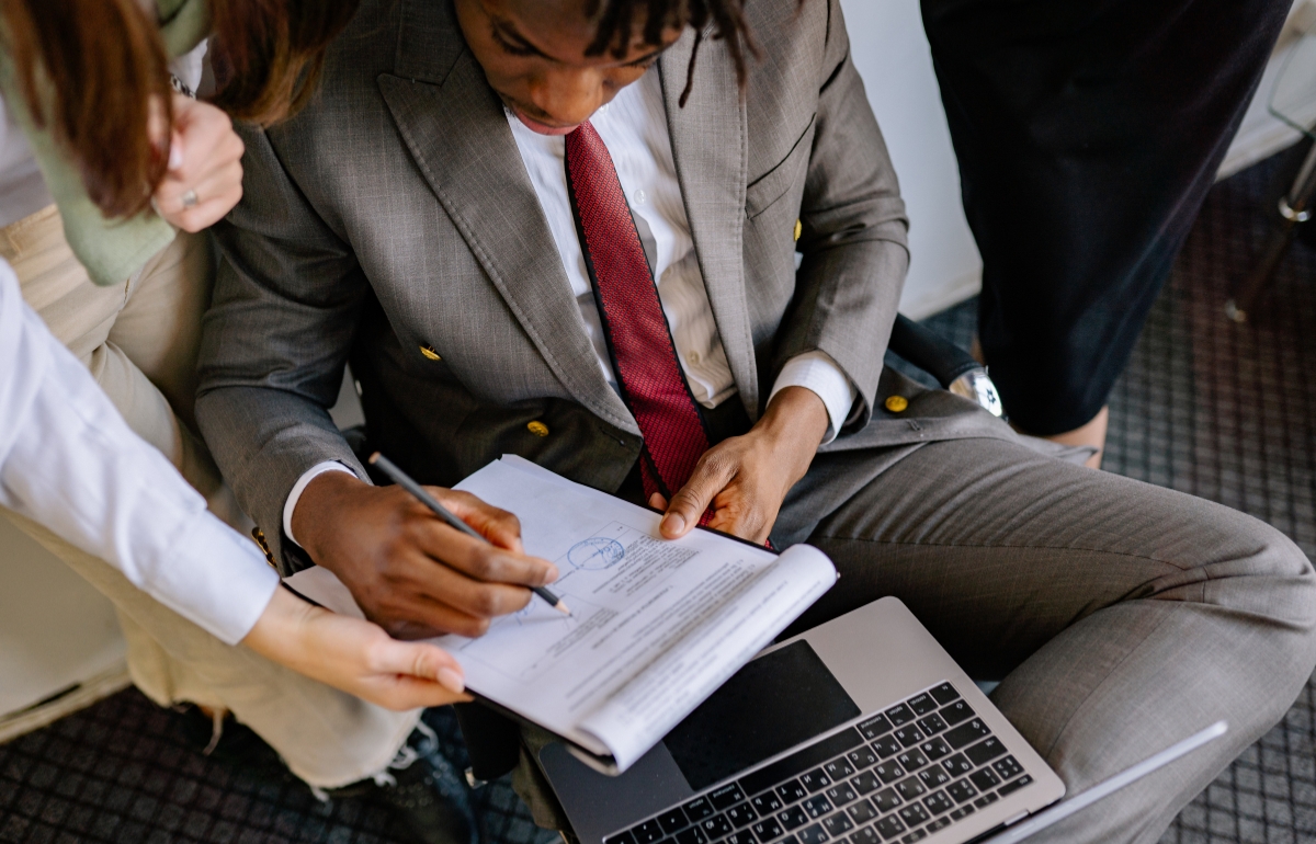 Legal & Tax Mistakes Startups concept with entrepreneur and documents